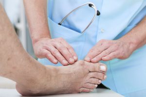 A doctor checking a patient’s hammertoe | Foot and Ankle Specialist